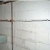 Severe foundation damage from a long crack in a bucking wall of a Girdwood home.