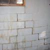 A cracked foundation wall near a window in a Angoon home