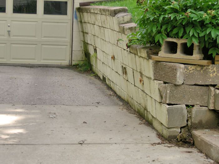 a failing retaining wall around a driveway in Anchorage