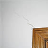 wall cracks along a doorway in a Girdwood home.