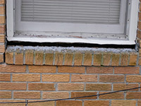 A window sill cracking and separating from the foundation wall in a Skagway home.