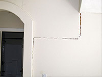 Drywall cracking due to foundation settlement in Hoonah