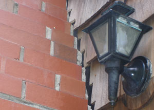 A tilting chimney in Copper Center showing serious foundation damage.