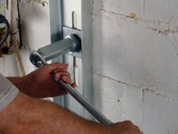 Mounting a foundation wall channel anchor in Chugiak.