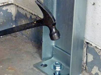 Mounting a foundation channel anchor installation to the floor in Chugiak.