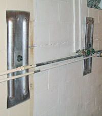 A foundation wall anchor system used to repair a basement wall in Yakutat