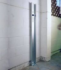 A failing foundation wall repaired with a foundation wall channel anchor system in a Palmer home.