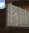 I-beam foundation wall supports installed in a Pelican basement.