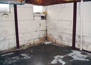 A failed, rusty i-beam foundation wall system installed in Indian.