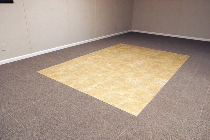tiled and carpeted basement flooring installed in a Eagle River home